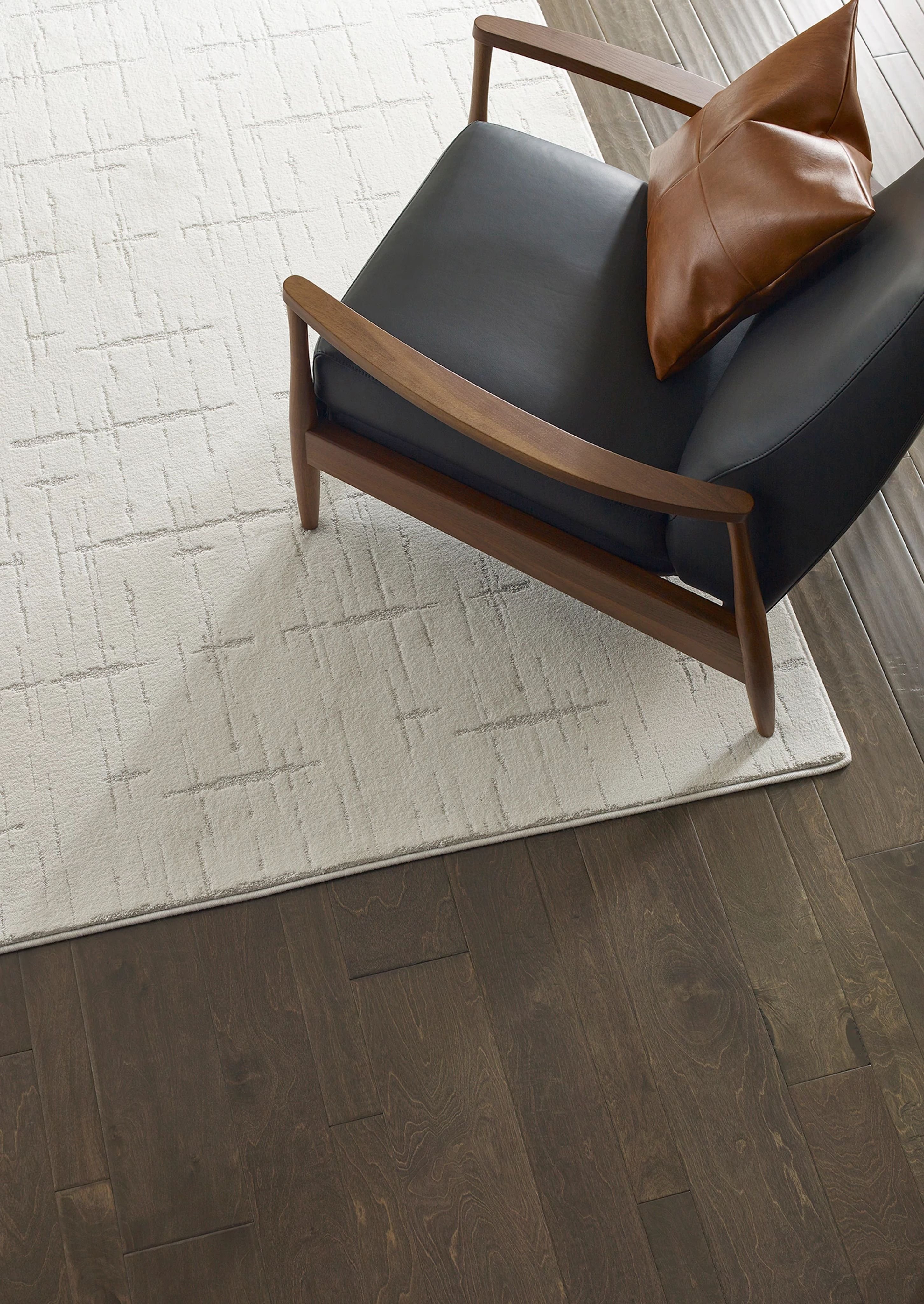 mid-century modern arm chair on white area rug - Carpet Plus Flooring LLC
