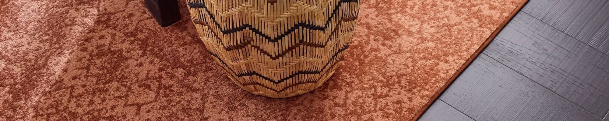 About Page banner Image showing Hardwood Floor and A rug - Carpet Plus Inc