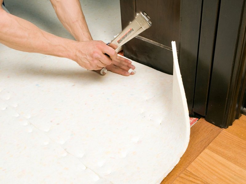 person installing underlayment - Carpet Plus Inc in Crofton, MD