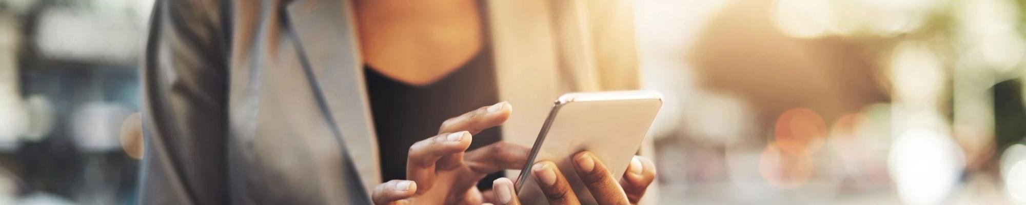 woman on smartphone from Carpet Plus Flooring LLC